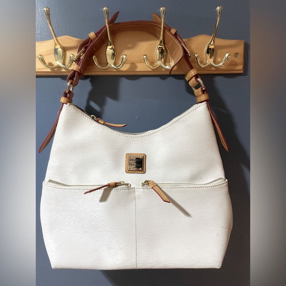 White leather Dooney & Bouke  hobo bag. Red trimming. Gold hardware